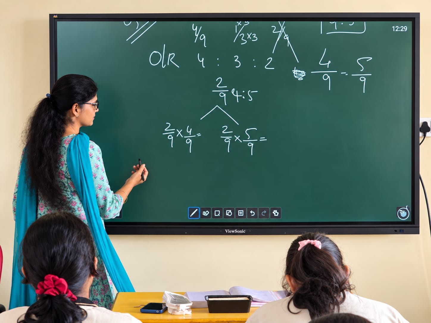 Teacher using the smart board in a North Point School classroom